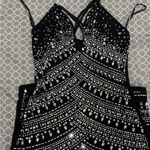 rhinestone filled black mini dress, not see through, has a zipper in the back